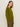 A woman with long, straight brown hair models the Sanctuary Clothing "must have cardi" in martini olive, paired with matching green pants, against a plain light backdrop, standing slightly turned to the side.