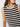 A woman models the Sanctuary Clothing crochet shell sweater in chalk black stripe, a sleeveless top shown from shoulders to waist against a plain background. Her face is partly visible with long brown hair over one shoulder.