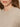 Close-up of a woman wearing the Sanctuary Clothing perfect sweater tee in heather pearl. Only the lower half of her face, neck, and part of her hair and shoulder are visible.