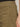 Close-up of a person wearing Sanctuary Clothing's cruiser full length pant in dirty martini, featuring visible stitching, front and side pocket details, and part of a hand resting near the pocket. Waistband details are clearly shown.
