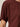 Close-up of a person wearing the Sanctuary Clothing shirred waist dolman tee in chicory. The short sleeves and upper torso are visible against a plain, neutral background.