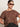 A woman wearing Sanctuary Clothing’s the perfect tee boheme extended sizing stands against a plain light background with her hand on her hip, sunglasses on, and dark high-waisted pants.