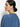 A person with dark hair tied back is seen from a slight side angle, wearing the tie front volume blouse in blue slate by Sanctuary Clothing. They have small hoop earrings and a neutral expression against a plain white background.