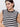 A person smiles slightly against a plain white background, wearing a Sanctuary Clothing black macrame stripe maxi dress with contrast trim.