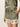 Someone is wearing Sanctuary Clothing's "Spring Breaker Short Mezzo Sage," a sleeveless outfit with matching shorts. It features an ornate green floral pattern in shades of peach, brown, and cream. One hand rests in a shorts pocket.