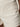 Close-up of a person wearing Sanctuary Clothing™s voyage short in bleached white, highlighting the waistband, seam, and side rectangular pocket.