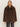 A person with straight blond hair wears the Sanctuary Clothing carmen fur coat morel and dark pants, standing against a plain light background.