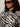 A person with curly hair wears black sunglasses and the Sanctuary Clothing soiree barn jacket striking zebra (extended sizing). The photo is cropped at the shoulders.
