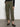 A person models the Sanctuary Clothing rebel pant hiker green cargo joggers, featuring side pockets, paired with black flat shoes; photo shows only the lower half of their body against a plain background.