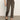 The lower half of a person is shown wearing Sanctuary Clothing's carnaby kick crop leggings in french kitty, standing on a gray floor against a plain off-white background.