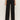 A person is shown from the waist down wearing Sanctuary Clothing's black runway ponte trouser with black shoes, standing against a plain light background.