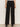 A person is shown from the waist down wearing Sanctuary Clothing's black runway ponte trouser with black shoes, standing against a plain light background.