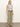 A woman with straight blonde hair and a neutral expression stands against a plain background wearing Sanctuary Clothing's district column ankle jean bamboo.