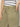 A person wearing Sanctuary Clothing’s district column ankle jean bamboo, an olive green high-waisted pant with large front pockets, paired with a white and black striped top, shown from waist to mid-thigh.