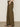 A person wearing Sanctuary Clothing's cruiser full length mossy green pants, featuring a high-waisted, wide-leg design with side pockets and black heeled sandals, stands against a neutral background.