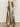 Person wears Sanctuary Clothing's Cadence Relaxed Straight Pant in platinum, paired with cream ankle boots and a lace top. The cropped image shows only the lower body against a plain background.