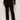 Person wearing black pants and a black top against a white background