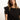 A person with long brown hair is wearing a black relaxed muscle tee by Sanctuary Clothing. They are positioned in front of a neutral background, gazing slightly to the side.