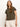 A person with long hair models the Sanctuary Clothing embroidered perfect tee kalamata, a dark green short-sleeved top with floral embroidery. They're styled against a plain background, wearing light-colored pants and a gold pendant necklace.