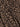 Close-up of the dreamers top french kitty by Sanctuary Clothing, featuring a brown and black leopard print with irregular black spots on a light brown background and slightly visible fabric texture.