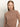 A woman with straight, light brown hair and fair skin wears the Sanctuary Clothing long sleeve draped mock neck top in mocha, standing against an off-white background. She looks at the camera with a neutral expression.