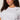 A woman with curly brown hair wears the Sanctuary Clothing embellished tee in white (extended sizing) featuring sparkling jeweled details, paired with gold hoop earrings, standing against a neutral background with a calm expression.