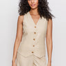 A woman with long curly hair models the Sanctuary Clothing relaxed modern vest sand sequin stripe and matching pants, standing against a plain light background.