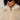 A woman with curly hair wears black oval sunglasses and the Sanctuary Clothing silky fur vest in almond cream (extended sizing), featuring a zippered collar.