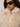 A woman with curly hair wears black oval sunglasses and the Sanctuary Clothing silky fur vest in almond cream (extended sizing), featuring a zippered collar.