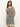 Someone with long hair is wearing the Sanctuary Clothing "summer shell dress" in chalk black stripe, standing against a plain light-colored background.