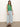 Against a white background, a person wears Sanctuary Clothing's open stitch shell sweater in palm and light blue wide-leg jeans. They have long brown hair and black sandals.