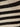Close-up of the mesh stitch shell sweater by Sanctuary Clothing, featuring black and chalk horizontal stripes that highlight the textured knit pattern.