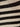Close-up of the mesh stitch shell sweater by Sanctuary Clothing, featuring black and chalk horizontal stripes that highlight the textured knit pattern.
