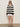 A woman wears the Sanctuary Clothing textured raglan crew in chalk black stripe (size 6), styled with white shorts, black sandals, dark sunglasses, and hoop earrings. Her arms are relaxed by her sides against a plain background.