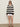 A woman wears the Sanctuary Clothing textured raglan crew in chalk black stripe (size 6), styled with white shorts, black sandals, dark sunglasses, and hoop earrings. Her arms are relaxed by her sides against a plain background.