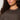 A woman with curly dark hair wears the Sanctuary Clothing Sparkle Sequin Sweater Ink (extended sizing), shown from the shoulders up against a light background.