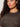 A woman with curly dark hair wears the Sanctuary Clothing Sparkle Sequin Sweater Ink (extended sizing), shown from the shoulders up against a light background.