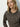 A woman with long blonde hair models the "must have cardi french kitty" leopard print button-up sweater by Sanctuary Clothing, standing against a light background and looking slightly to the side.