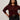 A woman with curly hair models the Sanctuary Clothing boucle cardi in dark crimson (extended sizing), paired with dark high-waisted jeans, standing against a plain light background with one hand on her hip and a neutral expression.