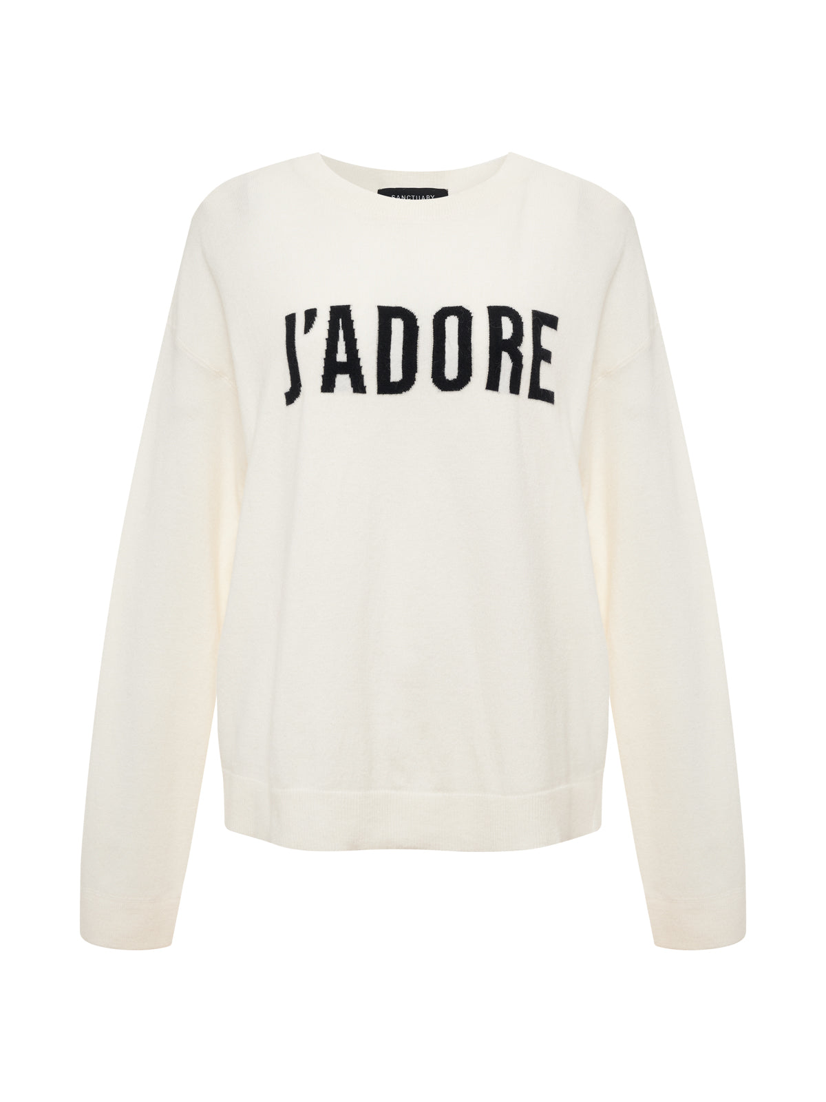 The Sanctuary Clothing 24/7 Popover Chalk with Black (extended sizing) is a white long-sleeve sweater featuring "J'ADORE" in bold black letters across the chest, shown on a plain white background.