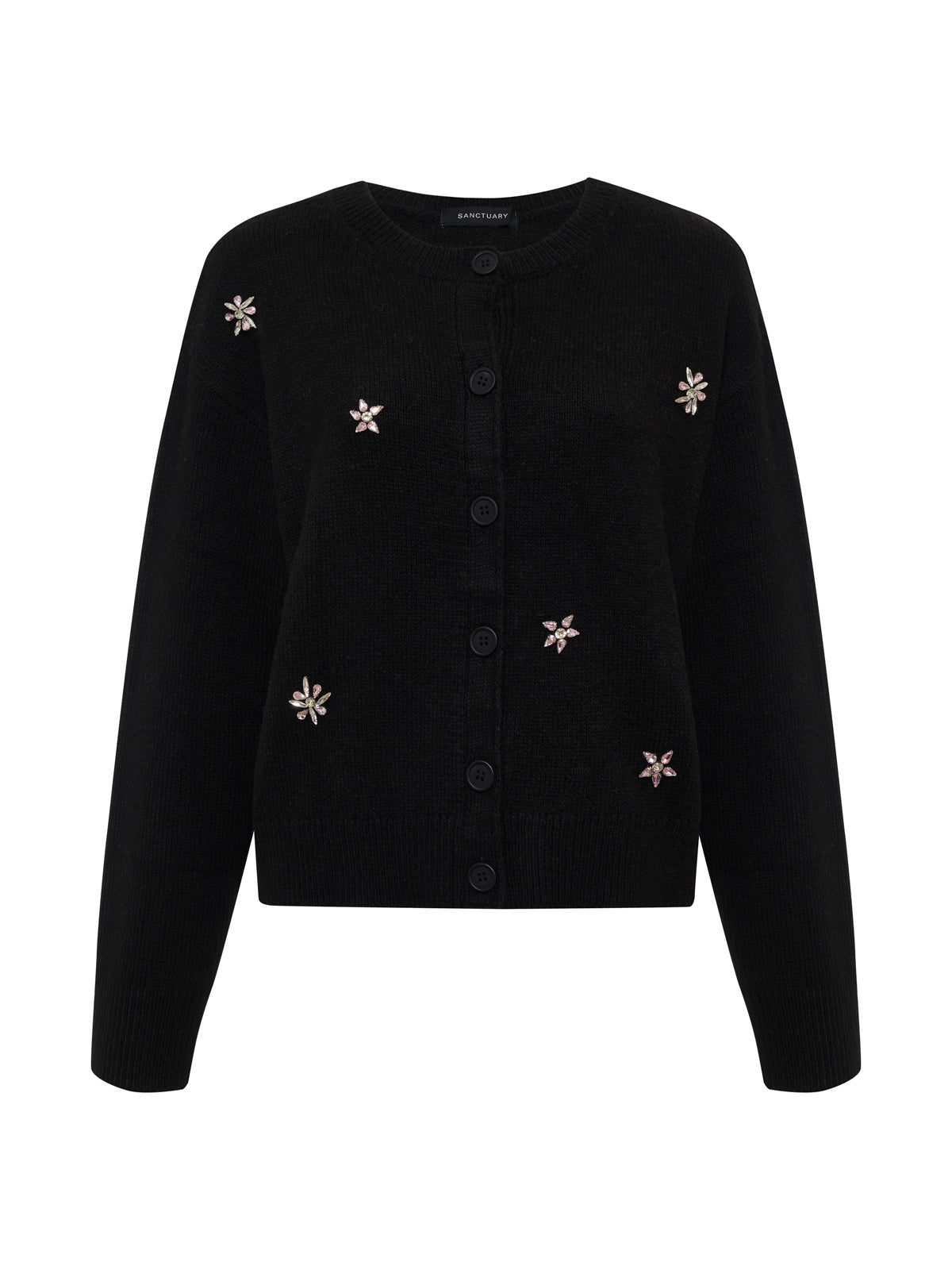 The must have gem cardi black by Sanctuary Clothing features long sleeves, front buttons, and delicate light floral embellishments scattered on the front.