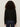 A person with curly brown hair, seen from the back against a plain light background, is wearing Sanctuary Clothing's must have gem cardi in black and dark blue jeans.