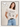 A woman in jeans and a pink "arent gonna keep quiet tee milk" by Sanctuary Clothing, featuring a cartoon print, stands smiling with one hand in her pocket against a white background with cloud doodles.