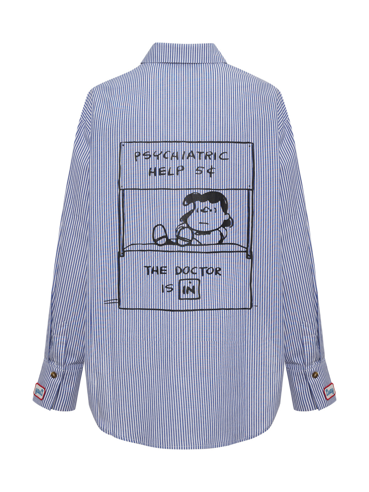 The doctor is in shirt blue and white stripe by Sanctuary Clothing features a black line drawing of Peanuts' Lucy at her psychiatric help booth with the sign "The Doctor is IN" on the back.