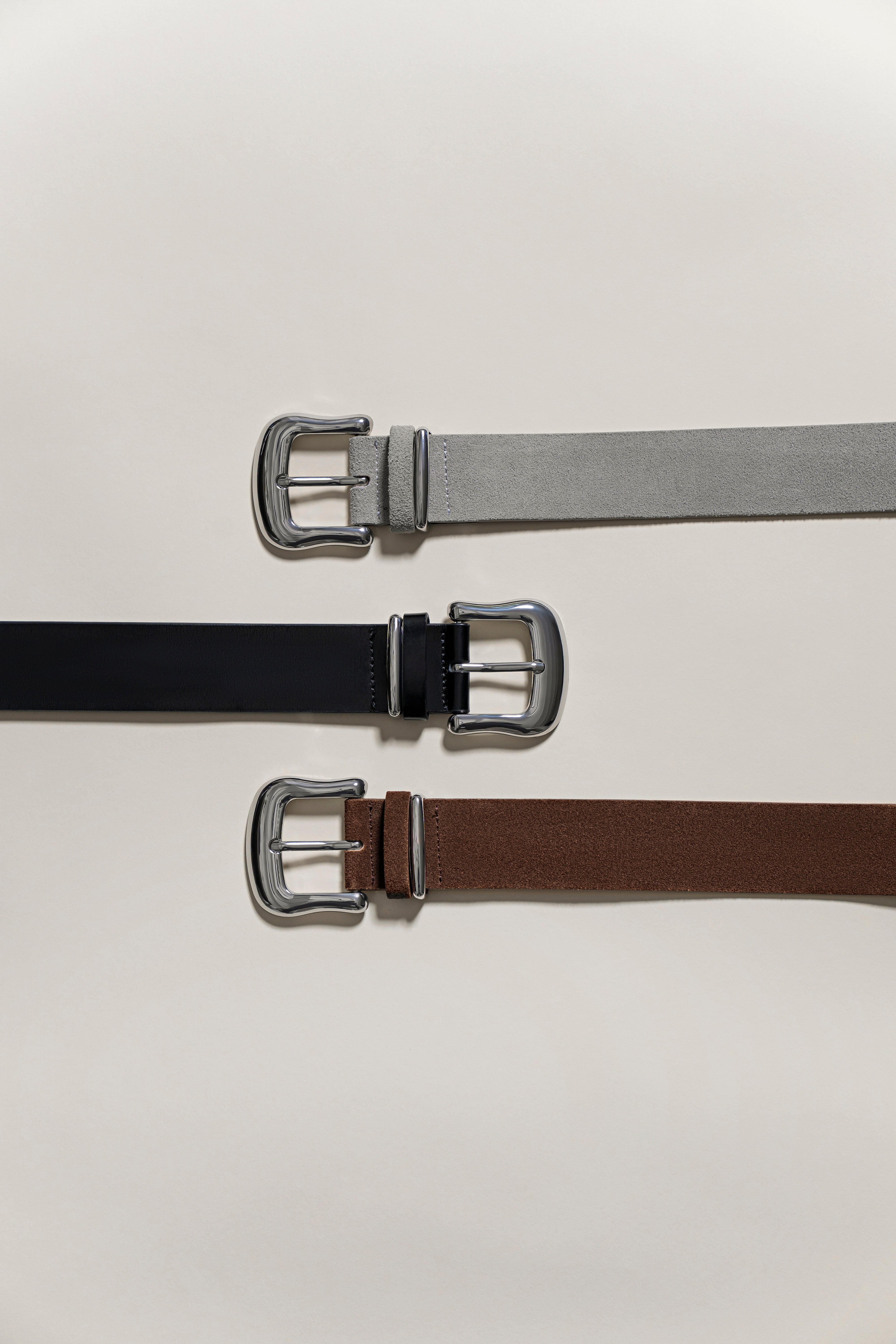 The Sanctuary Clothing rowan belt in stone is displayed horizontally on a light background, featuring a silver buckle facing left.