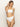 A person with long, light brown hair is wearing the "refresh rib high leg high rise white" bikini from Sanctuary Clothing. They are standing with one hand touching their hair against a plain light background.