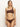 A person with long hair stands confidently wearing Sanctuary Clothing's "stay connected one shoulder bikini top espresso," featuring a strap with a hoop detail, against a plain, light-colored wall.