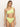 A woman with long blonde hair models the Sanctuary Clothing stay connected high rise bikini bottom in daiquiri, featuring a one-shoulder design with a knot detail, posed against a light backdrop.