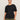 A woman with dark hair tied back wears the Sanctuary Clothing shirred waist dolman tee in black (extended sizing), paired with olive green cargo pants, standing against a plain light background and looking confidently at the camera.