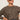 A woman in the Sanctuary Clothing 24 7 popover french kitty top and blue jeans poses confidently against a plain light background, wearing dark sunglasses.